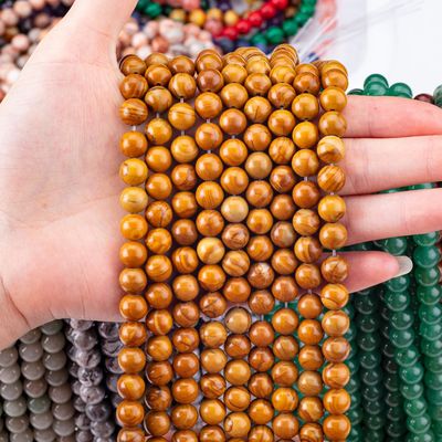 حبات الخشب الصفراء حبة مستديرة حبة كريستالية طبيعية حجر كريم خشب الياسبر حبات فضفاضة للجواهر