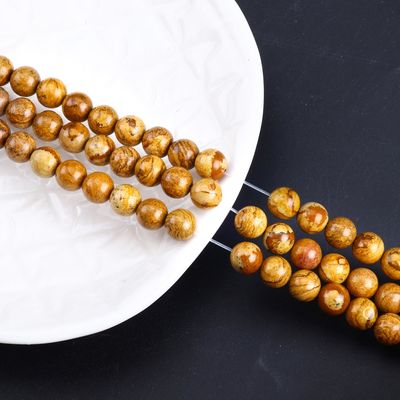 حبات الخشب الصفراء حبة مستديرة حبة كريستالية طبيعية حجر كريم خشب الياسبر حبات فضفاضة للجواهر