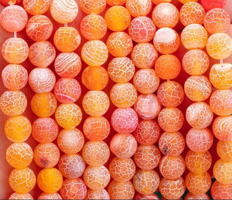 البرتقالي المتأثر بالطقس الزهري الخيوط الرقيقة الفضفاضة 2 ملم الخرز شبه الثمين